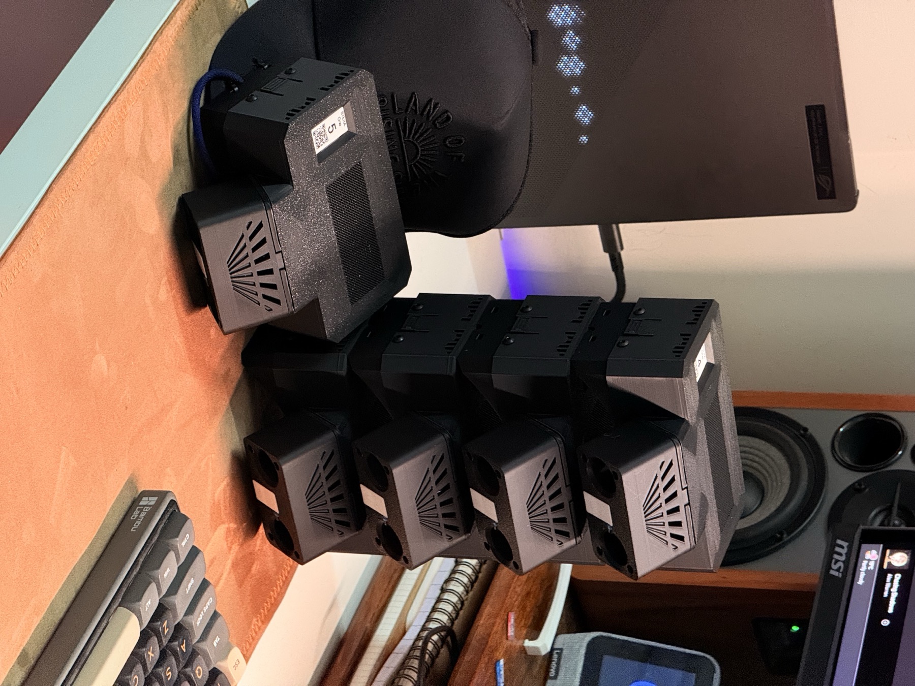 Part of the fleet on my desk. Thirteen of these got built by hand.